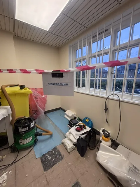 Asbestos floor tile and bitumen removal in Brixton